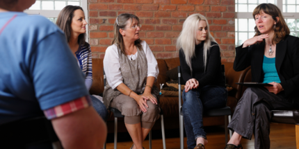 Group of adults sitting having a chat