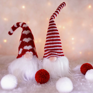 Two Christmas gnomes/gonks on a white background.