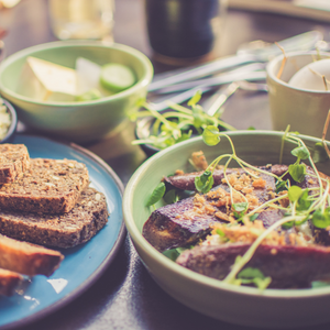 Plates with food on a table, waiting to be eaten