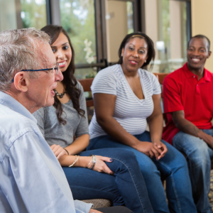 Mixed group of people sat talking