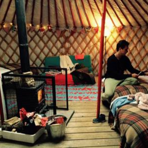 Inside of a yurt, looking cosy